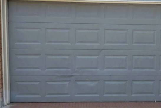 Garage Door Panel Repair Rosharon TX repair versus replacement